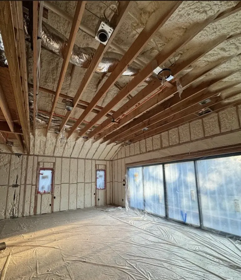 Interior walls and ceiling insulated with spray foam during new construction in Alfred